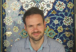 Man smiling staring ahead